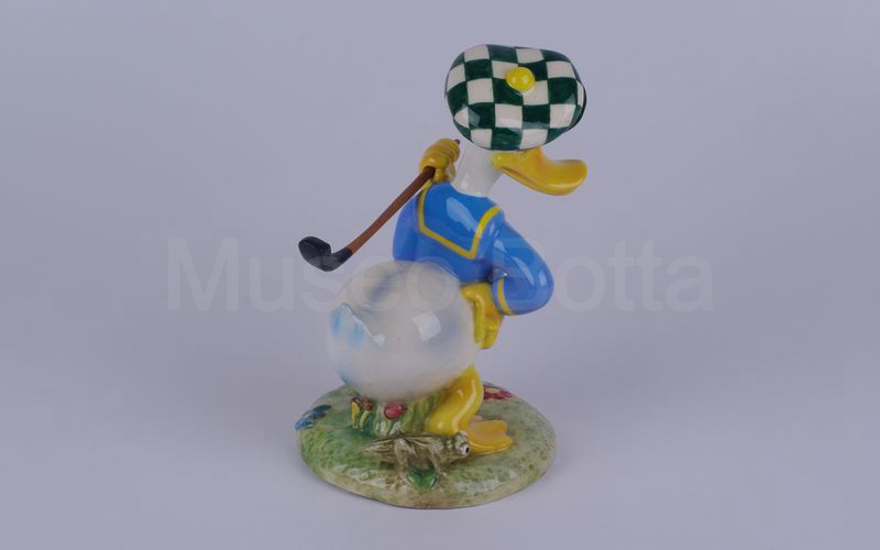 WALT DISNEY Paperino golfista con mazza in spalla in ceramica (Zaccagnini)